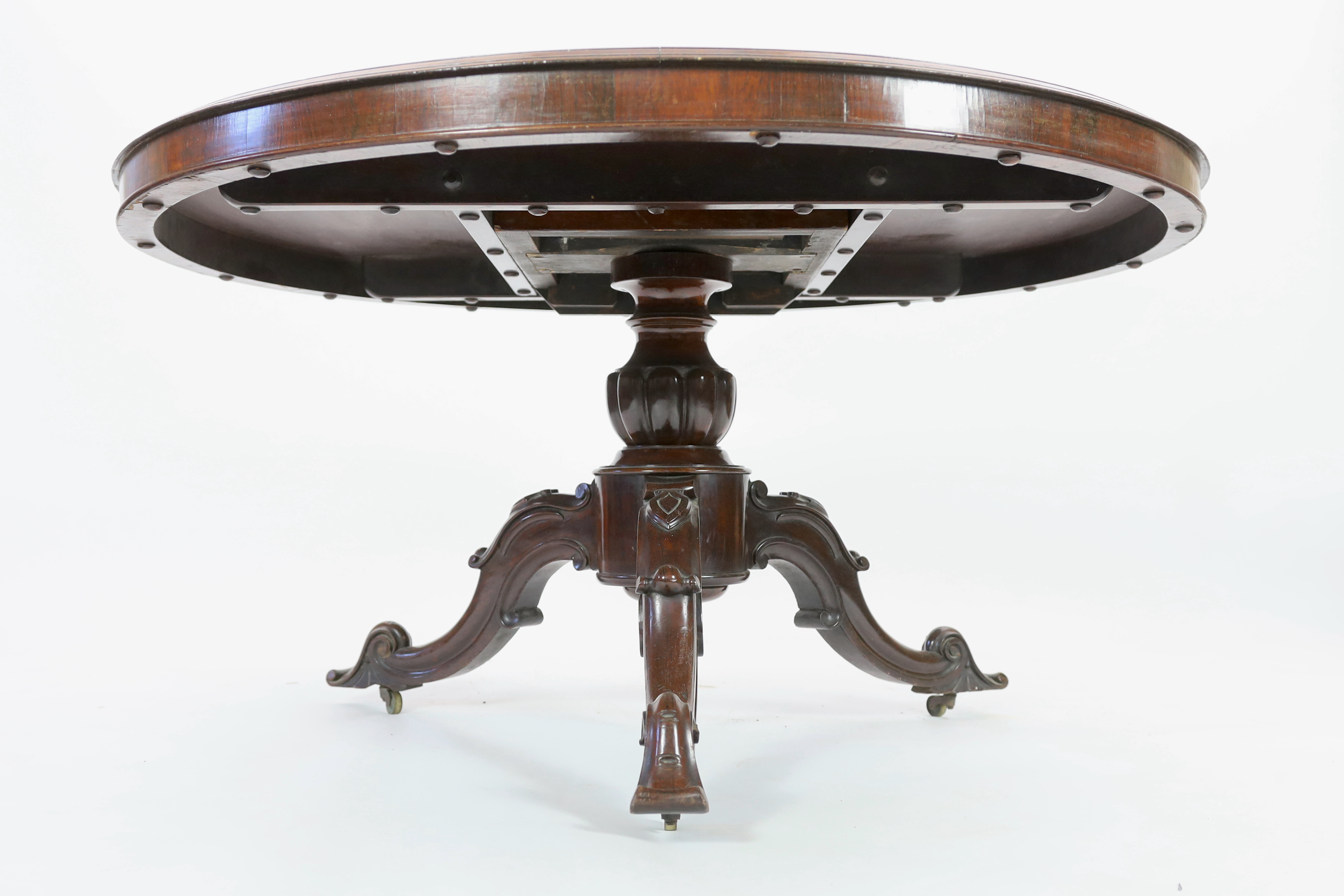 A Victorian and later marquetry inlaid walnut and rosewood breakfast table, diameter 132cm, height 74cm